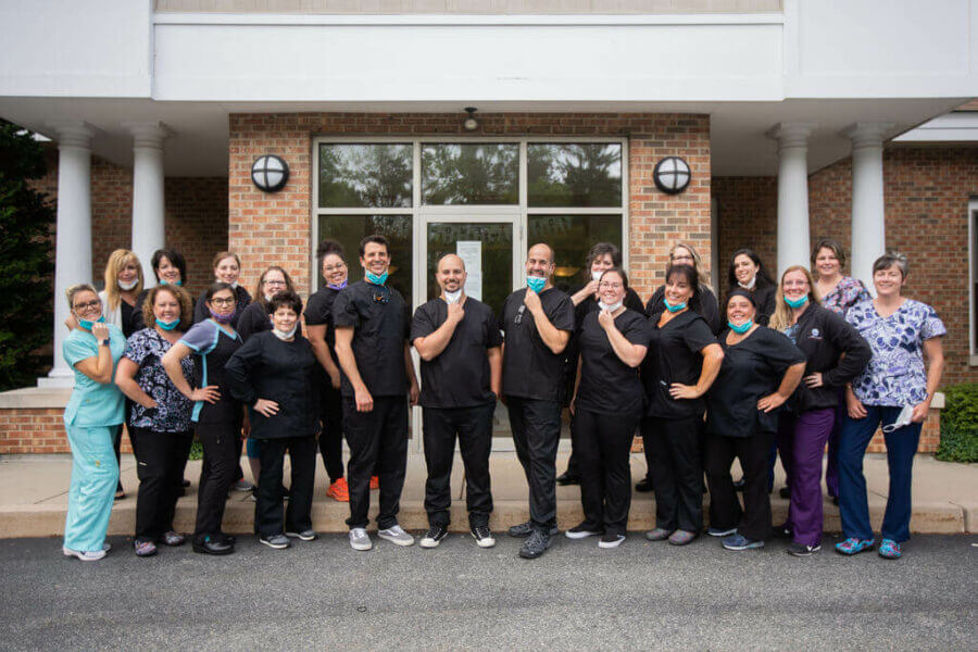 group shot of employees at RI Dental Arts